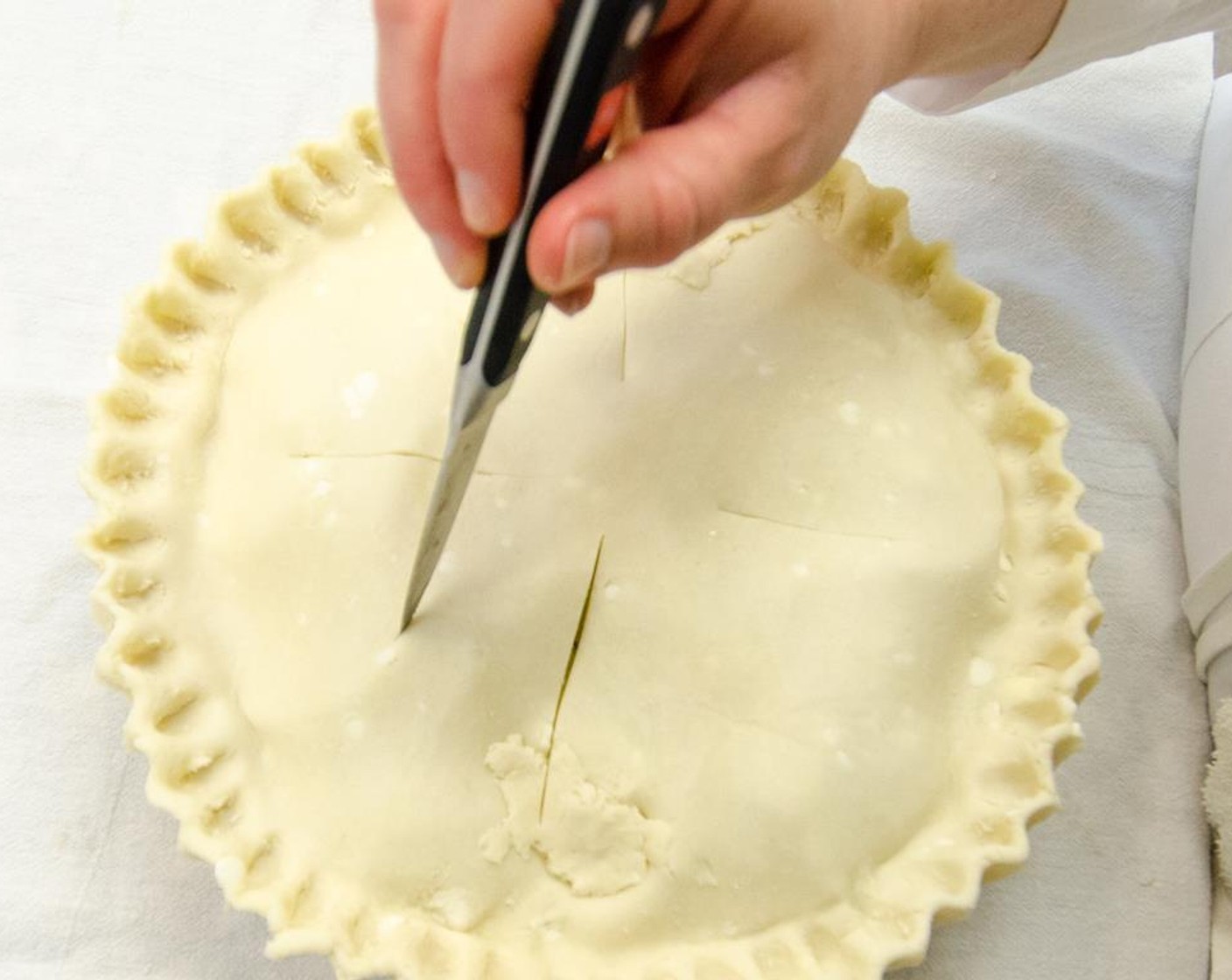 step 24 Cut three slits in top crust. Place pie in freezer for 10 minutes if dough is very soft and sticky.