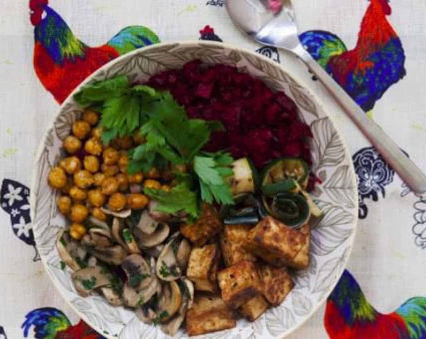 step 10 To assemble your Buddha bowl, lay the beet at the bottom of a bowl, top with mushrooms, tofu, grilled zucchini, roasted chickpeas and dress with a drizzle of extra virgin olive oil.