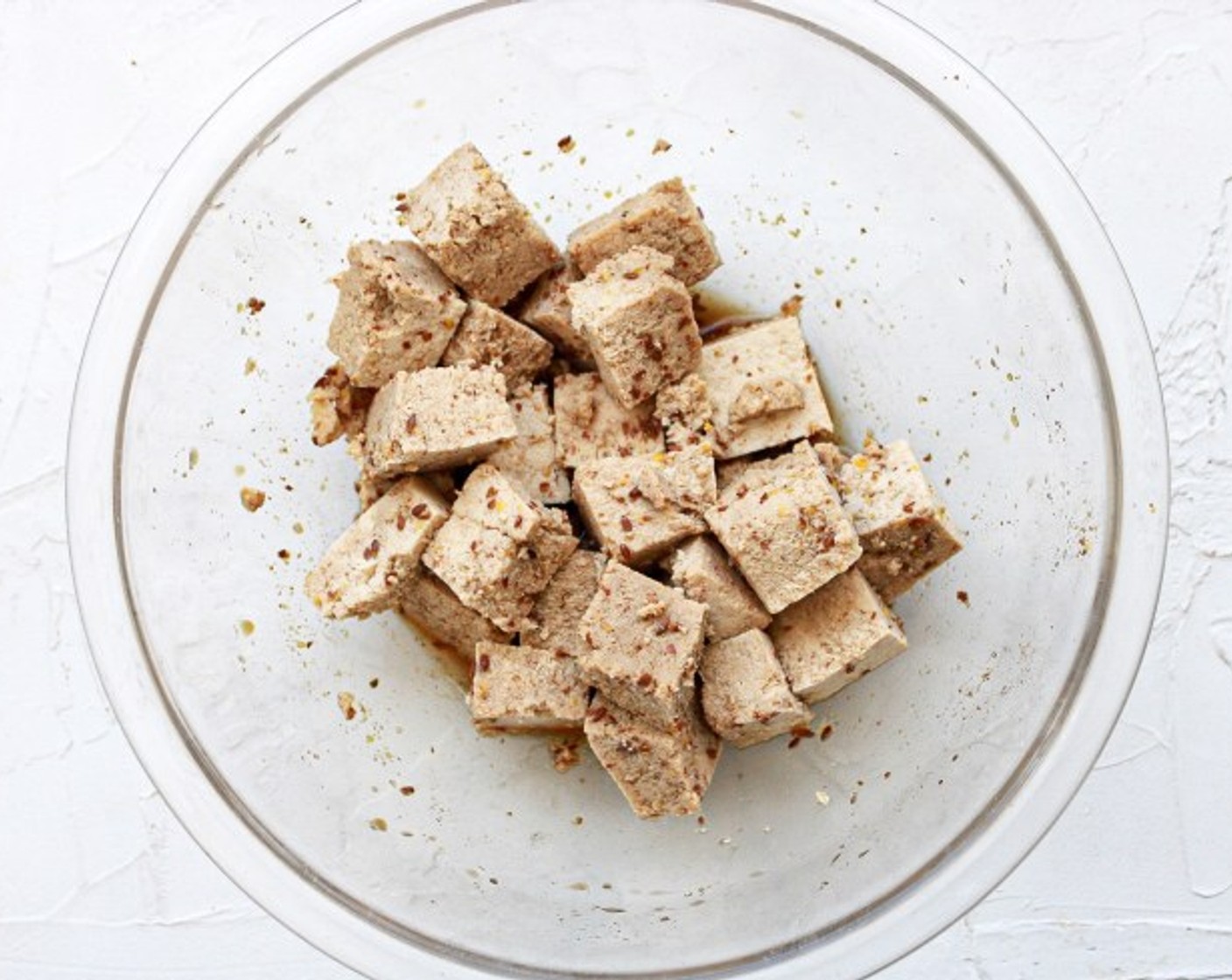 step 4 Gently fold your tofu cubes into the bowl until they are well coated. Cover your bowl and allow to sit for 25 minutes.