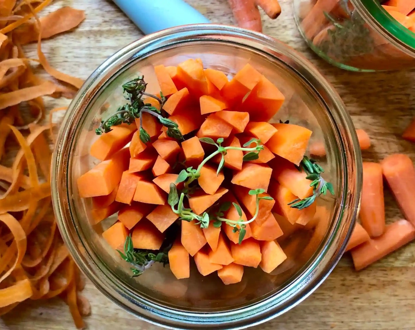 step 2 Based on the height of your jars, cut the Carrots (3 cups) into spears measuring 3/4-inch less than the height of each jar. Place the carrot spears on the end, filling each jar. Place the Fresh Thyme (6 sprigs) evenly throughout each jar as you fill it.