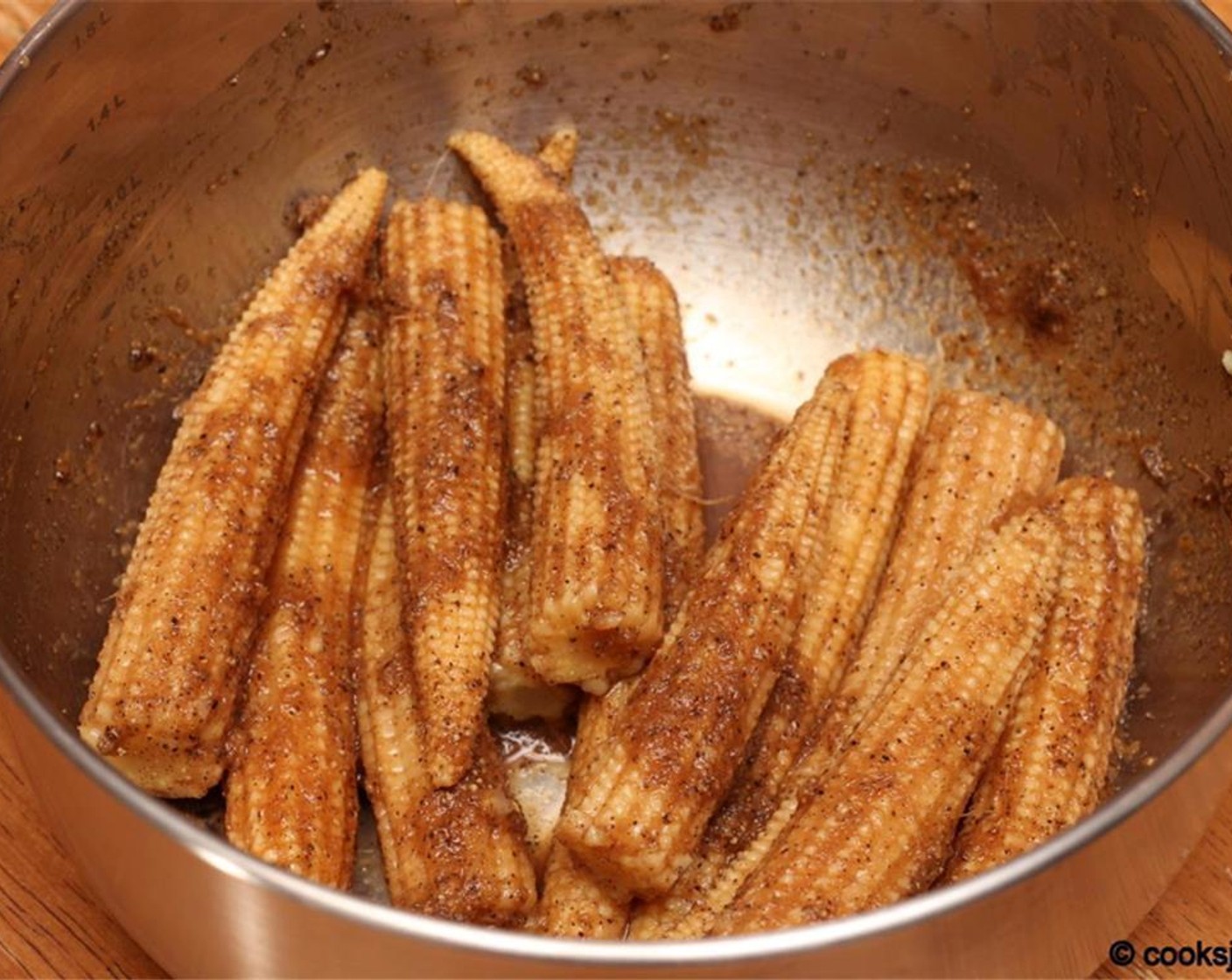 step 2 Use a fourth of the Soy Sauce (1 tsp), the Ginger Garlic Paste (1 tsp), Salt (1/2 tsp), Rice Vinegar (to taste) and Ground Black Pepper (1/2 tsp) to marinate the Baby Corn (14 pieces) for 30 minutes.