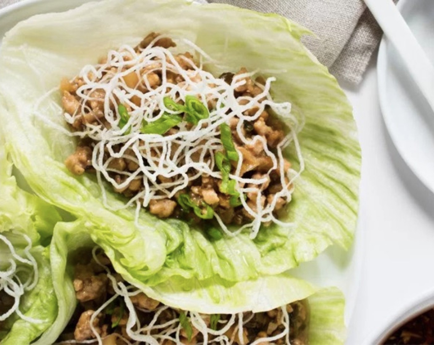 step 11 Gently pull off the leaves of the Iceberg Lettuce (1 head) and serve with the chicken, crispy rice sticks, dipping sauce, and extra Chinese hot mustard. Enjoy!