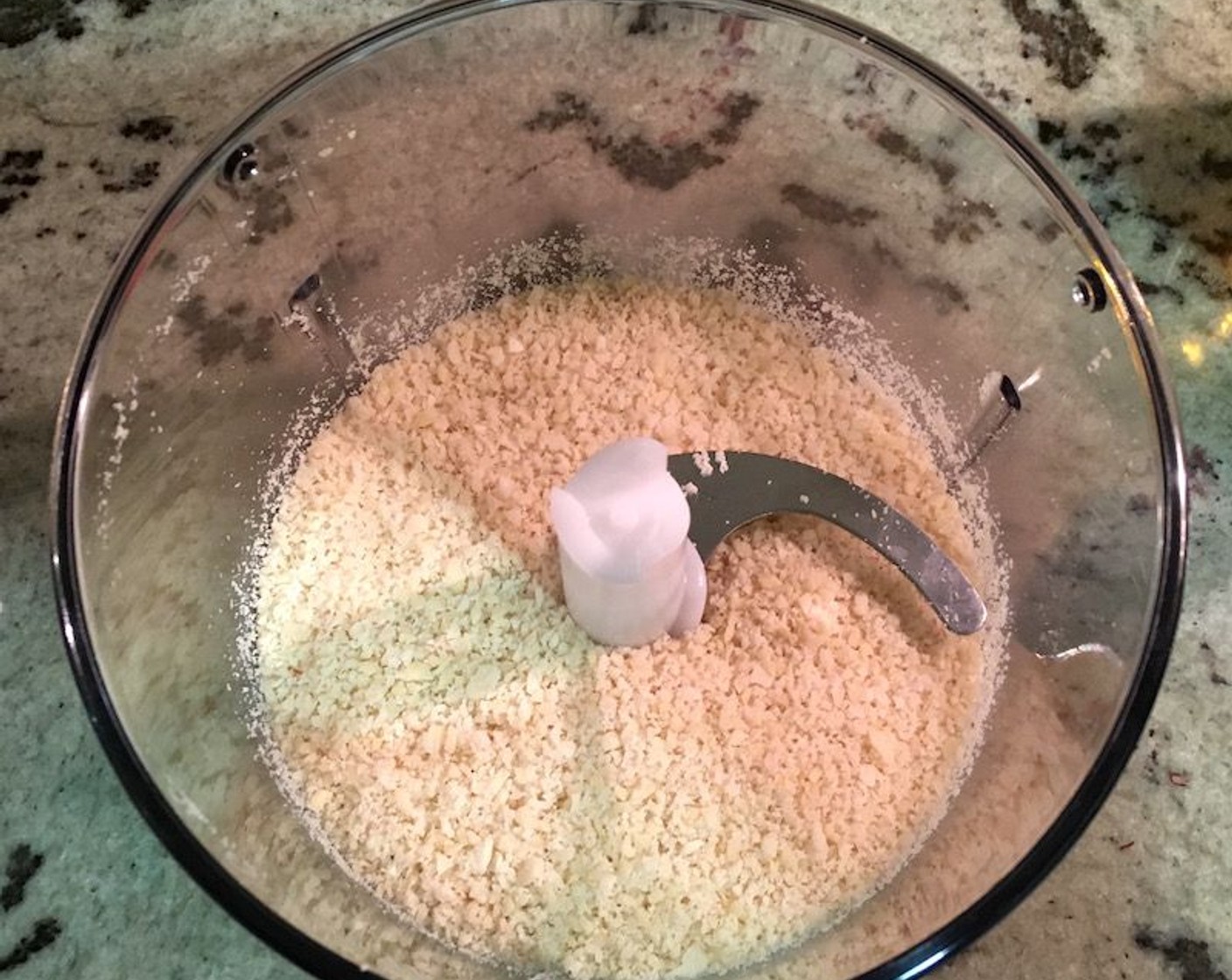 step 11 Place the Blanched Slivered Almonds (1/2 cup) in a food processor and blend into a fine grainy texture.