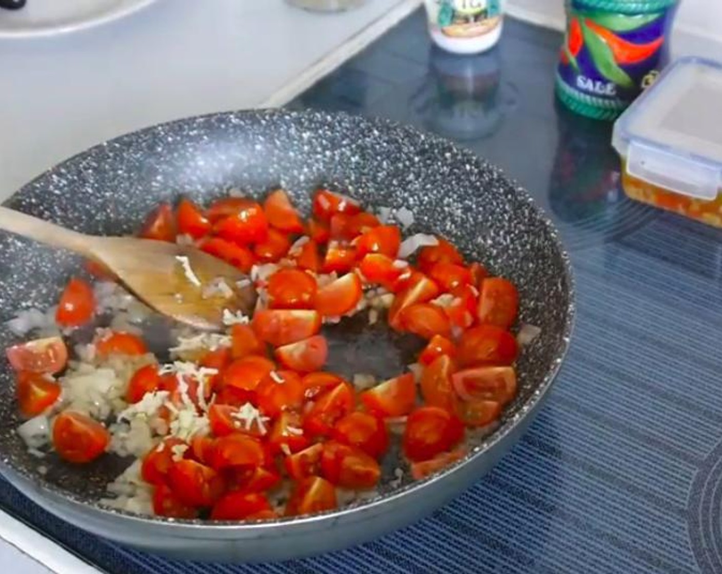 step 2 When the shallots are soft add the Cherry Tomatoes (2 cups) and Garlic (1 clove). Leave to cook for a few minutes until the tomatoes start to soften and the juice starts to come out.