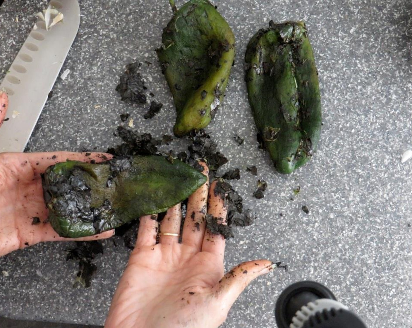 step 6 Remove poblano peppers from paper bag and rub the blackened skins from the flesh. Remove the stem and seeds and slice into long strips about 1/4" wide. Add poblanos to onions and place in oven to keep warm.