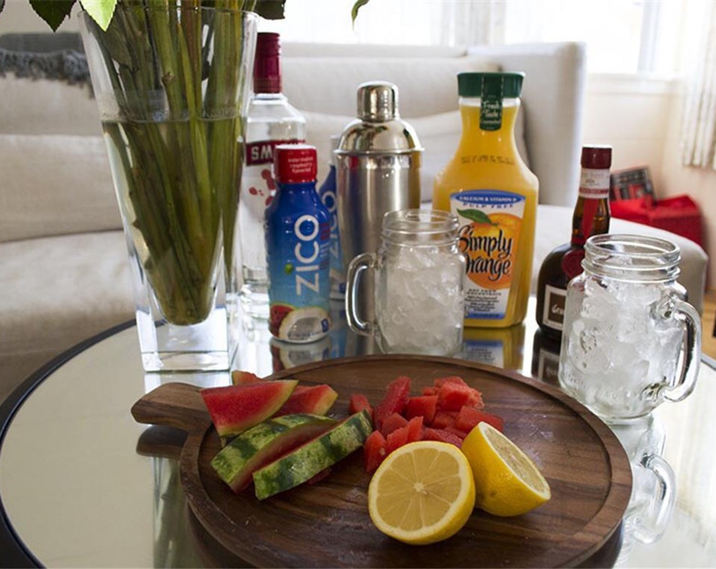 step 1 Combine ZICO®Watermelon Raspberry Flavored Premium Coconut Water (1 fl oz), Raspberry Vodka (1 fl oz), Orange (1/2), Grand Marnier (1 fl oz), and 0.5 fl oz of Lemon Juice (2) in a cocktail shaker and shake with a handful of Ice (as needed).