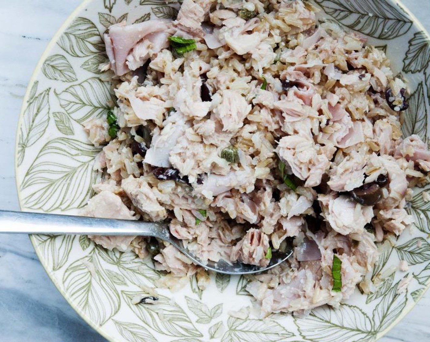 step 2 In a bowl, stir in Canned Tuna (1/2 cup), Capers (1 tsp), Parmesan Cheese (1 Tbsp), Prosciutto (2 oz), cooked Mahatma® 100% Whole Grain Brown Rice (2 Tbsp), Salt (to taste) and Ground Black Pepper (to taste) and Fresh Parsley (1 Tbsp).