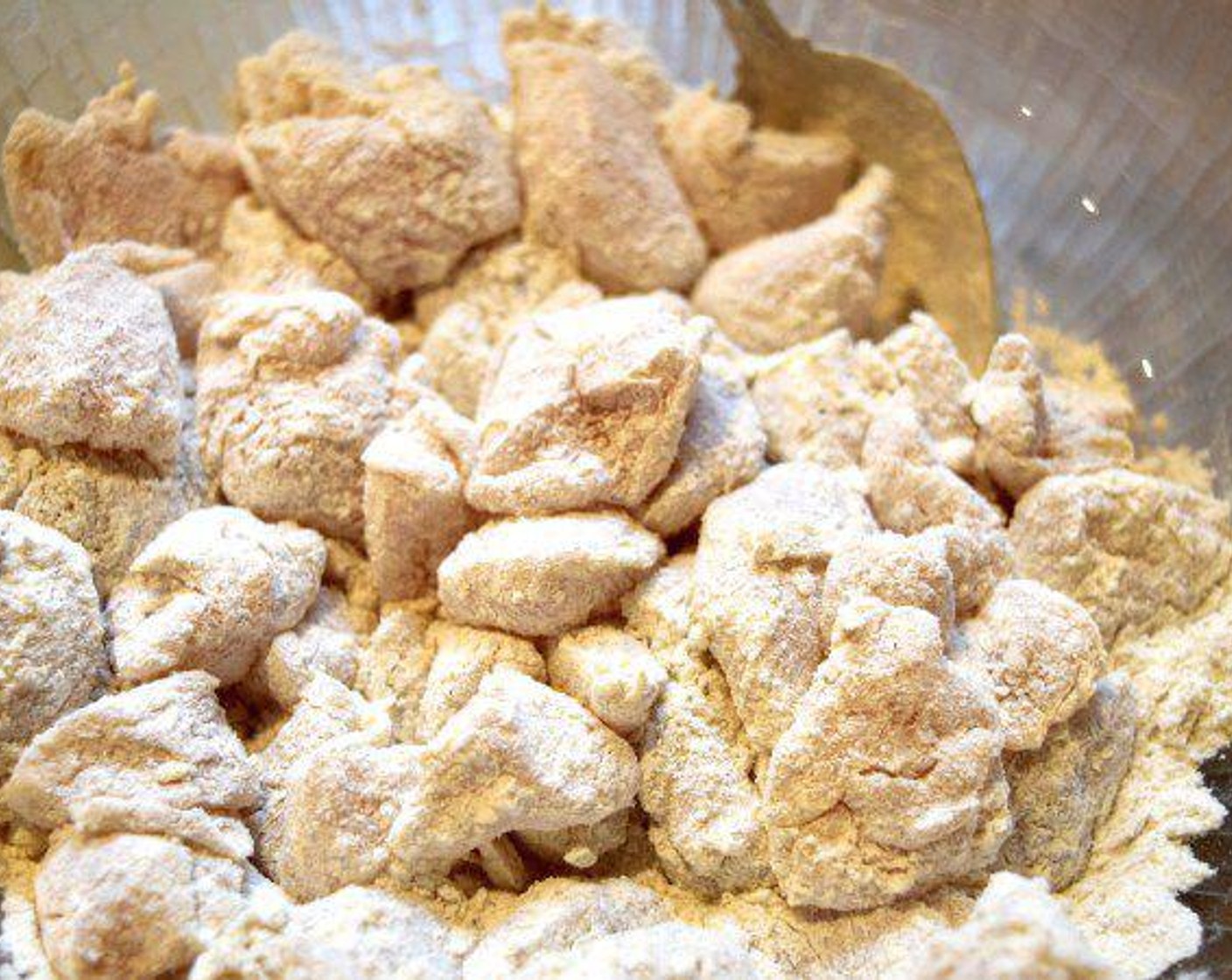 step 1 Cut Chicken Tenders (1 lb) into bite-sized pieces and add to a bowl. To that same bowl, add All-Purpose Flour (1 cup), Curry Powder (1 tsp), Salt (1 pinch), and Ground Black Pepper (1 pinch) and stir to coat the chicken.