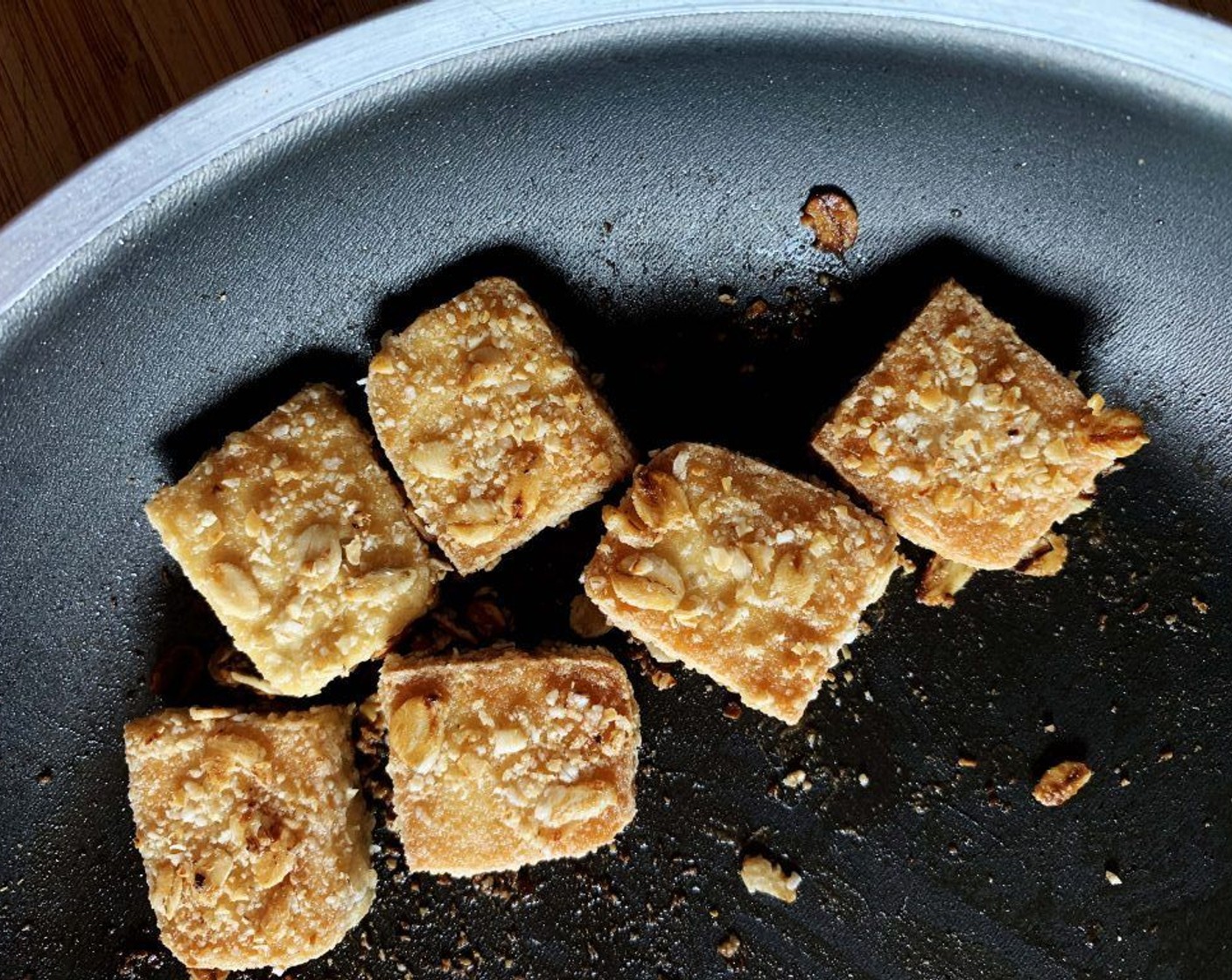 step 6 Heat up Coconut Oil (1 Tbsp) in a skillet. Once hot, cook the tofu on each side until crispy and golden-brown in color.