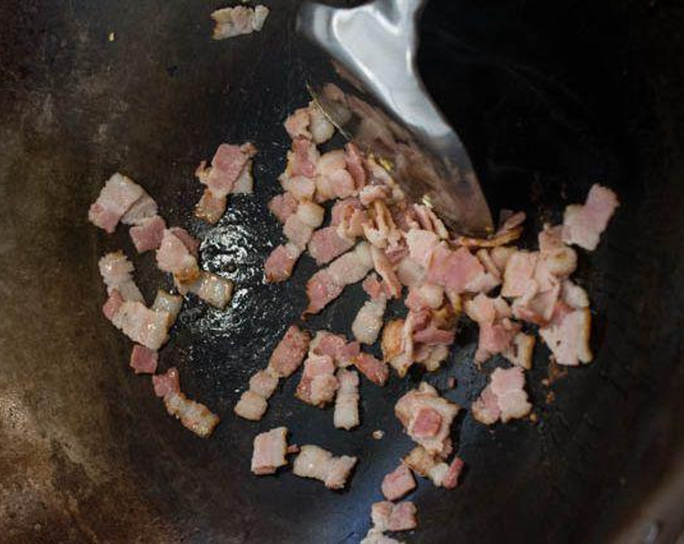 step 4 Add Bacon (4 slices) to the wok. Stir-fry until slightly brown. Fry till dark brown if you like your bacon crispy.