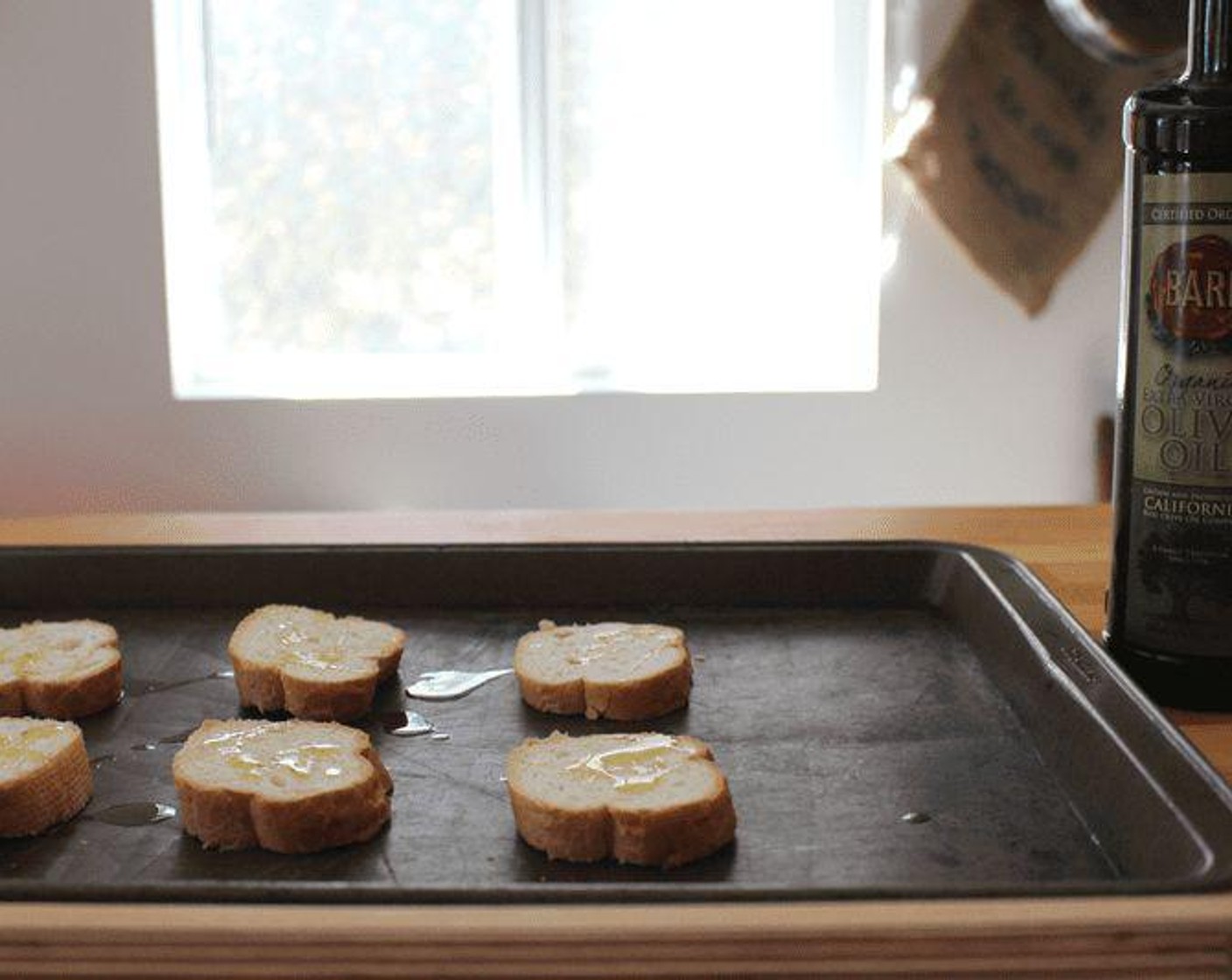 step 2 Drizzle baguette with Olive Oil (1 tsp).