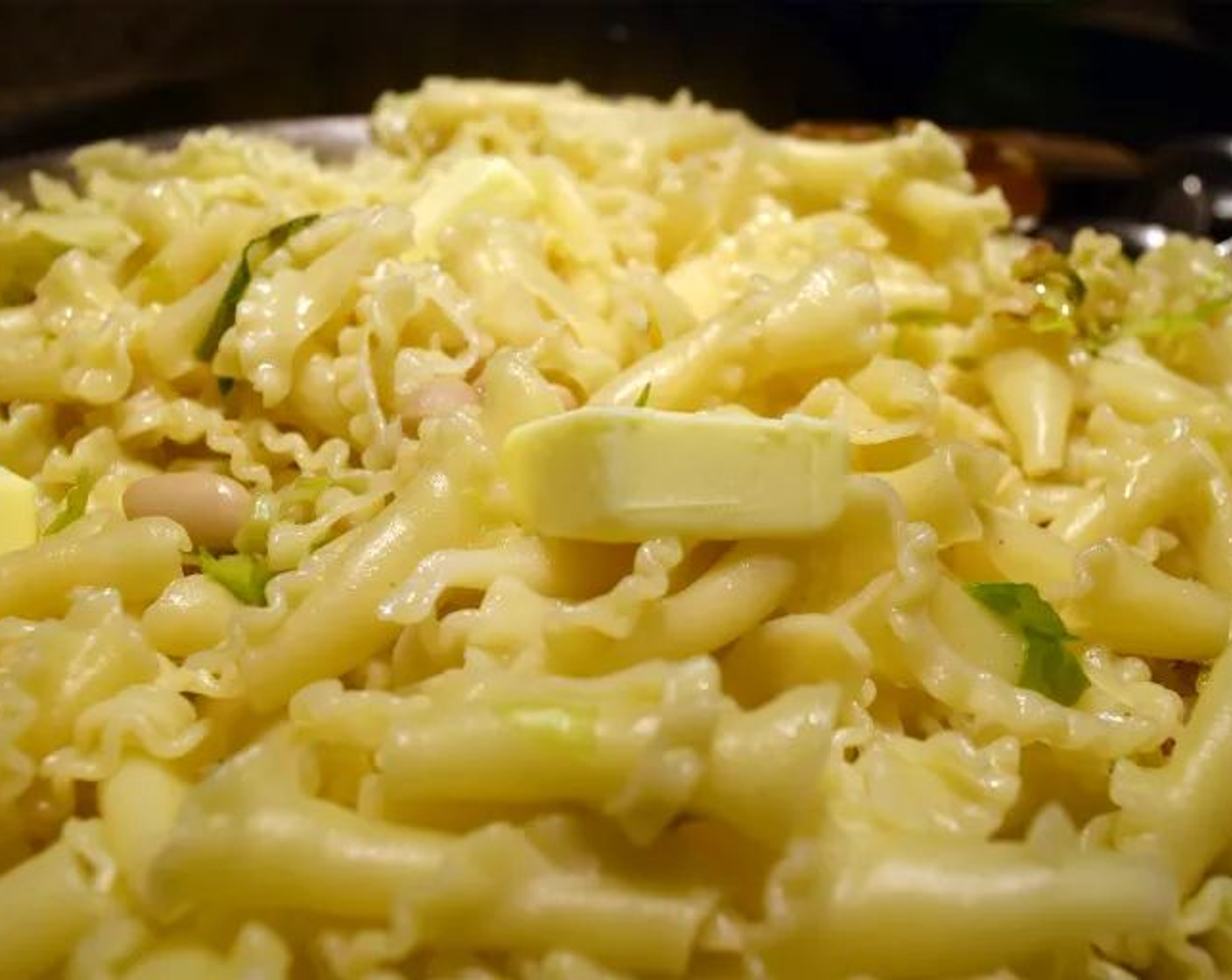 step 12 Add the pasta, remaining pasta water, and remaining Salted Butter (4 Tbsp) and toss everything together until combined.