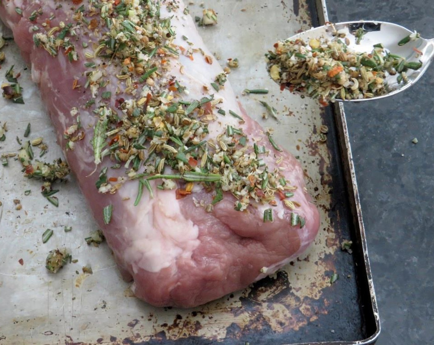 step 3 Place the Pork Tenderloin (1 lb) on a baking sheet and rub Olive Oil (1 Tbsp) over it with your hands. Sprinkle spice mixture over the pork and rub it in. There should be enough spice to liberally cover the entire tenderloin.