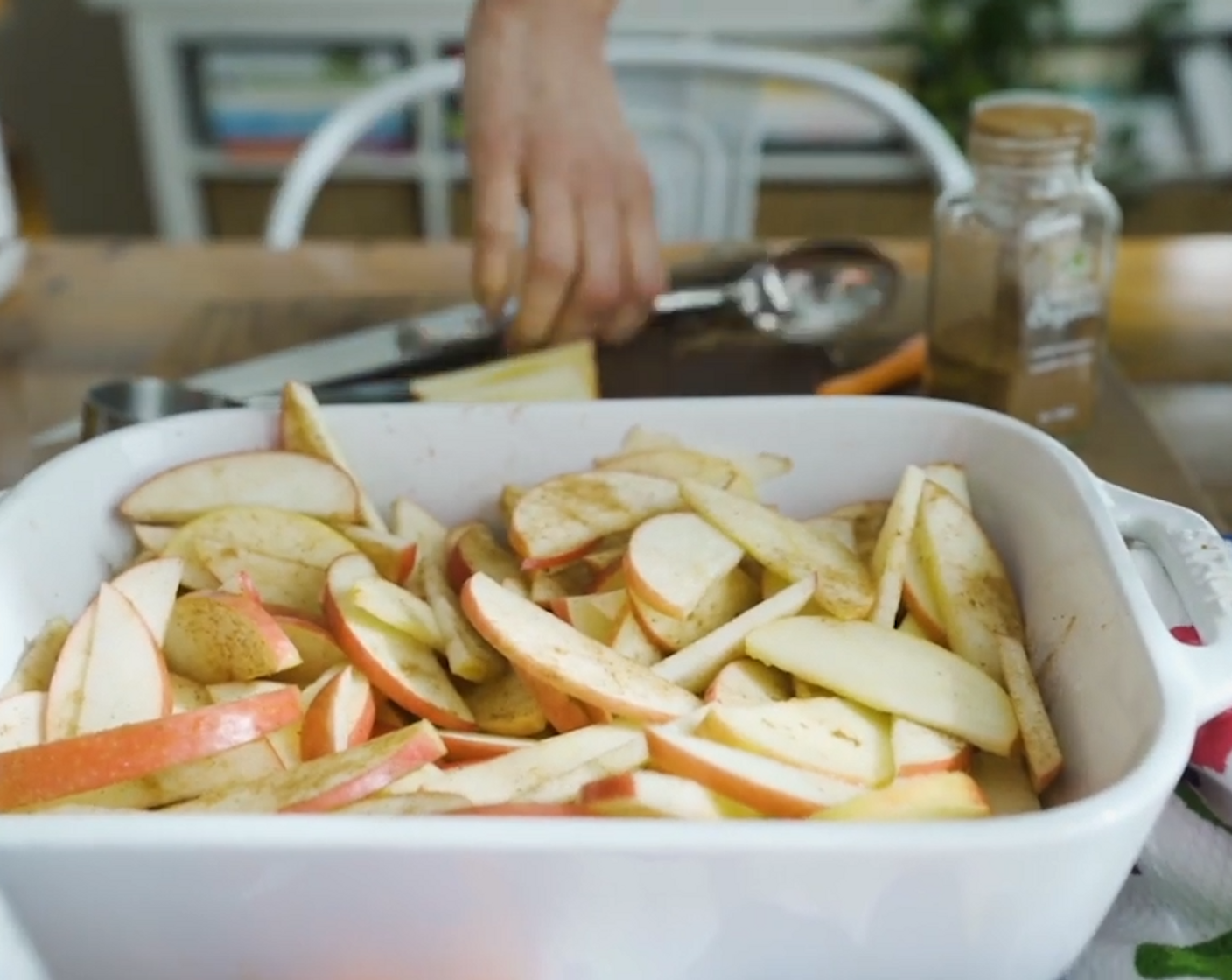 step 2 Place Pink Lady Apples (5) into the baking dish. Sprinkle with Simply Organic Cinnamon, Ground (1 tsp) and Ground Nutmeg (1/2 tsp). Pour the Filtered Water (1/2 cup) over the apples.