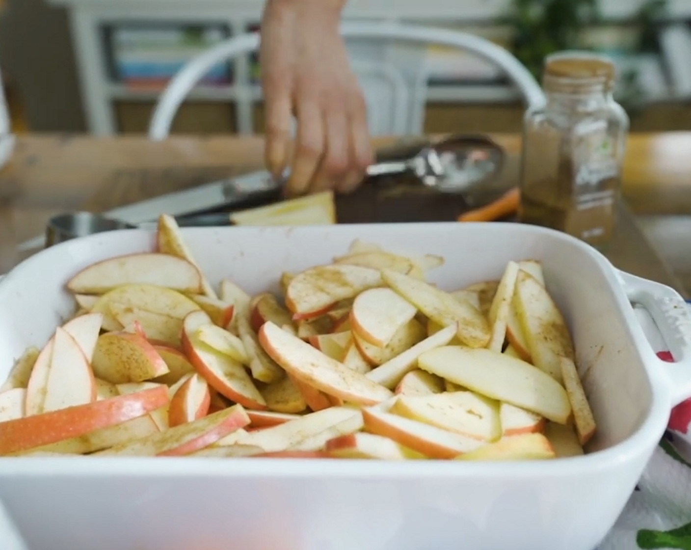 step 2 Place Pink Lady Apples (5) into the baking dish. Sprinkle with Ground Cinnamon (1 tsp) and Ground Nutmeg (1/2 tsp). Pour the Filtered Water (1/2 cup) over the apples.