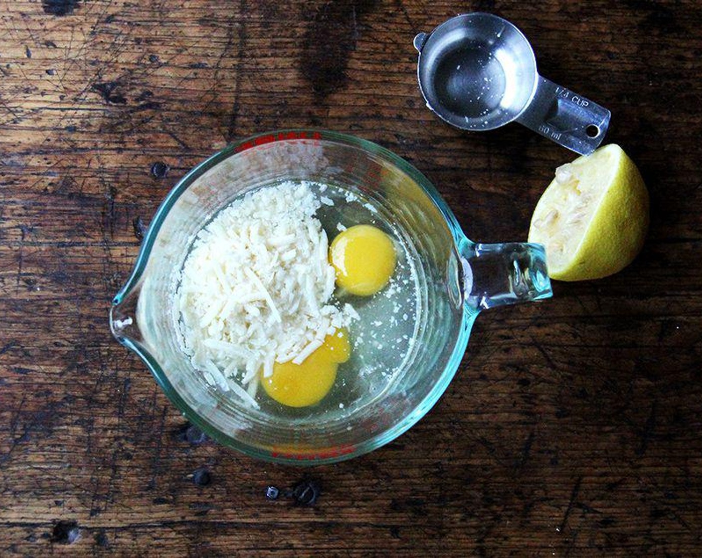 step 6 In a medium bowl or liquid measure, whisk together Farmhouse Eggs® Large Brown Eggs (2), Parmigiano-Reggiano (1/4 cup), and juice from Lemon (1). Whisk ¼ cup pasta water into the egg mixture.