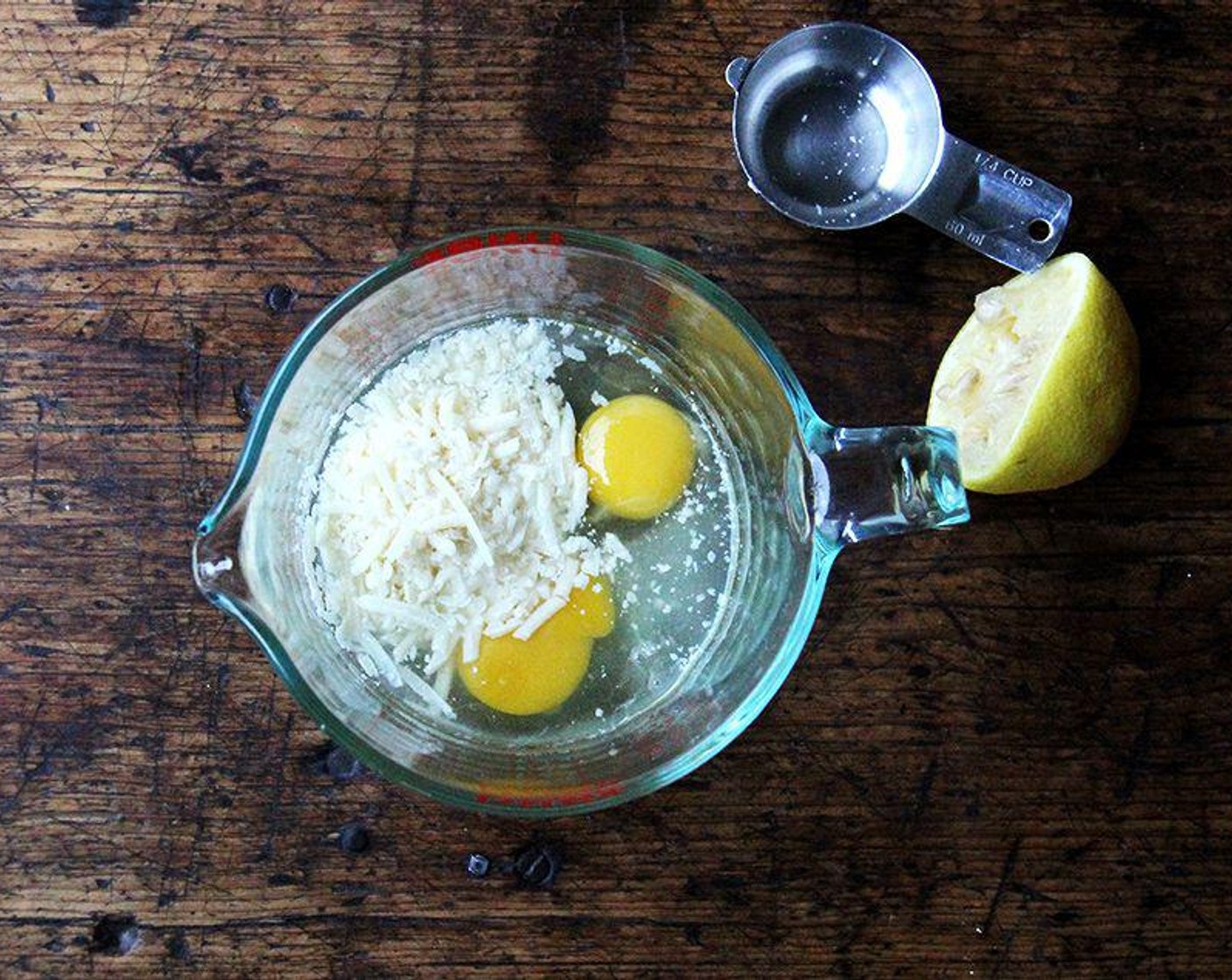 step 6 In a medium bowl or liquid measure, whisk together Farmhouse Eggs® Large Brown Eggs (2), Parmigiano-Reggiano (4 Tbsp), and juice from Lemon (1). Whisk ¼ cup pasta water into the egg mixture.