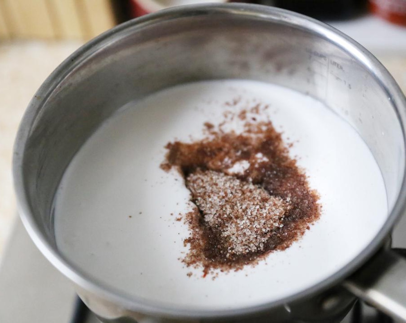 step 1 Place the Unsweetened Coconut Milk (3 cups), Cinnamon Sugar (1/4 cup) and Chung Jung One® Gochujang Korean Chili Sauce (3 Tbsp) in a saucepan.