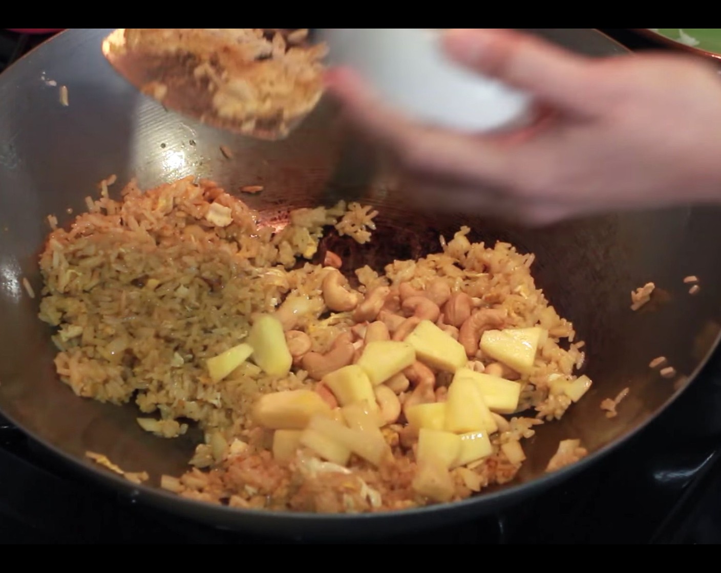 step 5 Add the Fresh Pineapple Chunk (1 cup), Raisins (to taste), and Cashew Nuts (to taste). Stir until everything is combined and heated through, then remove from heat.