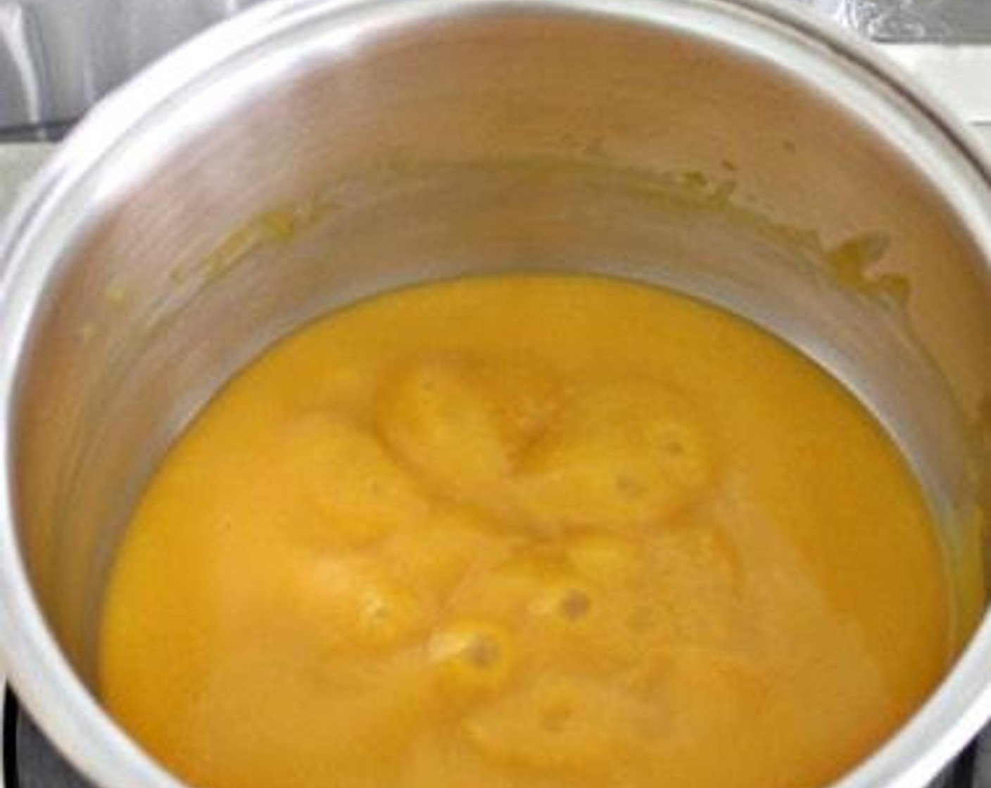 step 3 Combine blended pumpkin, Yakult (3/4 cup), the juice from Lemon (1) and Granulated Sugar (2 Tbsp) together in a pot. Stir well and bring to boil. Lower heat and keep stirring the pumpkin mixture for about 20-25 minutes until thickened.