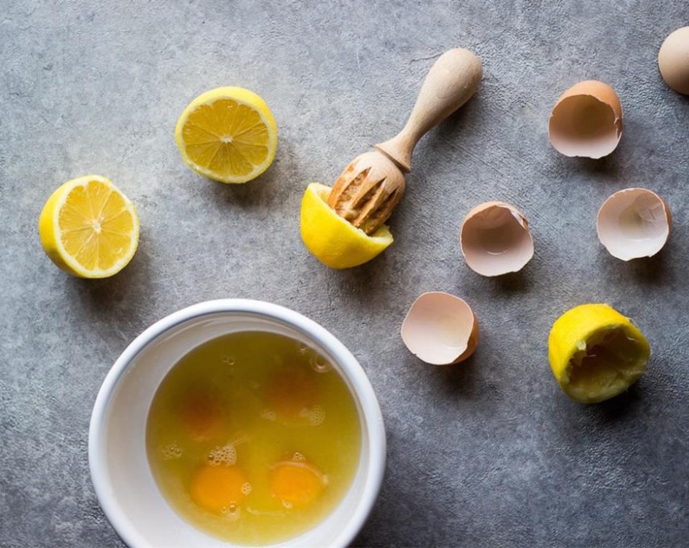 step 3 Meanwhile, whisk Eggs (4), and  Lemons (2), together in a bowl until frothy.