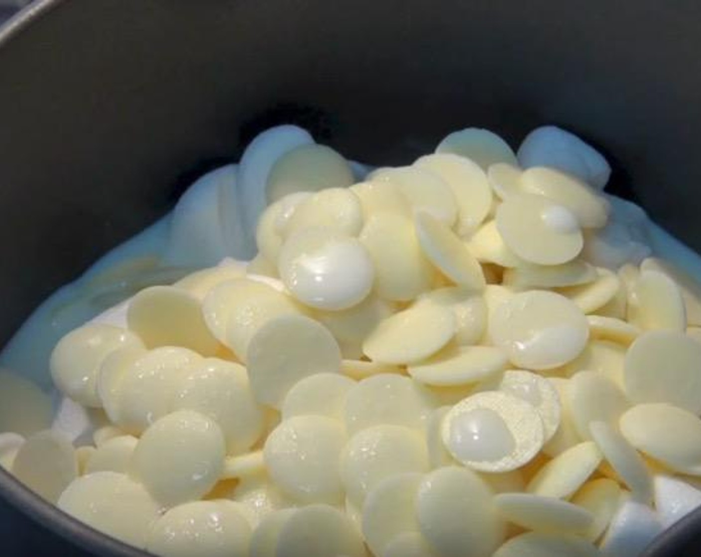 step 4 In a medium saucepan, add Marshmallows (5.5 oz), White Chocolate (1 cup) and Milk (1 cup). Over a low to medium heat, allow to melt together until smooth. Set aside to cool.