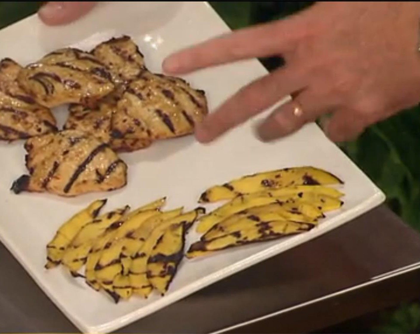 step 6 Spread the mango slices in an even layer on the preheated grill. Let the fruit char slightly, then flip and let char on the other side, about 3-4 minutes total. Remove grilled mango to a plate and set aside.