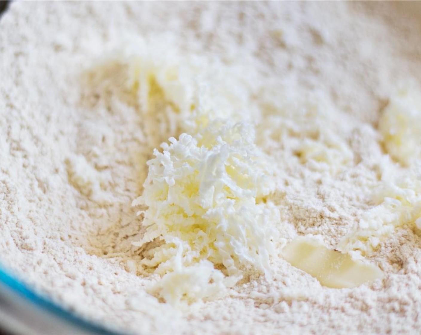 step 5 Remove the butter from the freezer and grate it directly into the flour mixture.