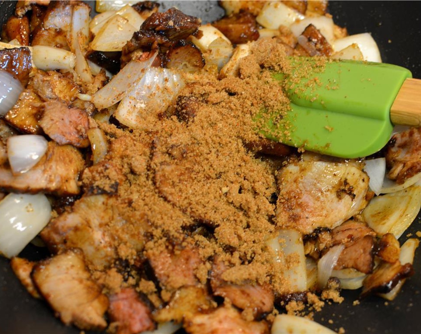 step 11 Add the remaining brown sugar-spice mix and stir it in with the pork so it starts caramelizing. Keep stirring the pork around in the caramel sauce, until it becomes sticky.