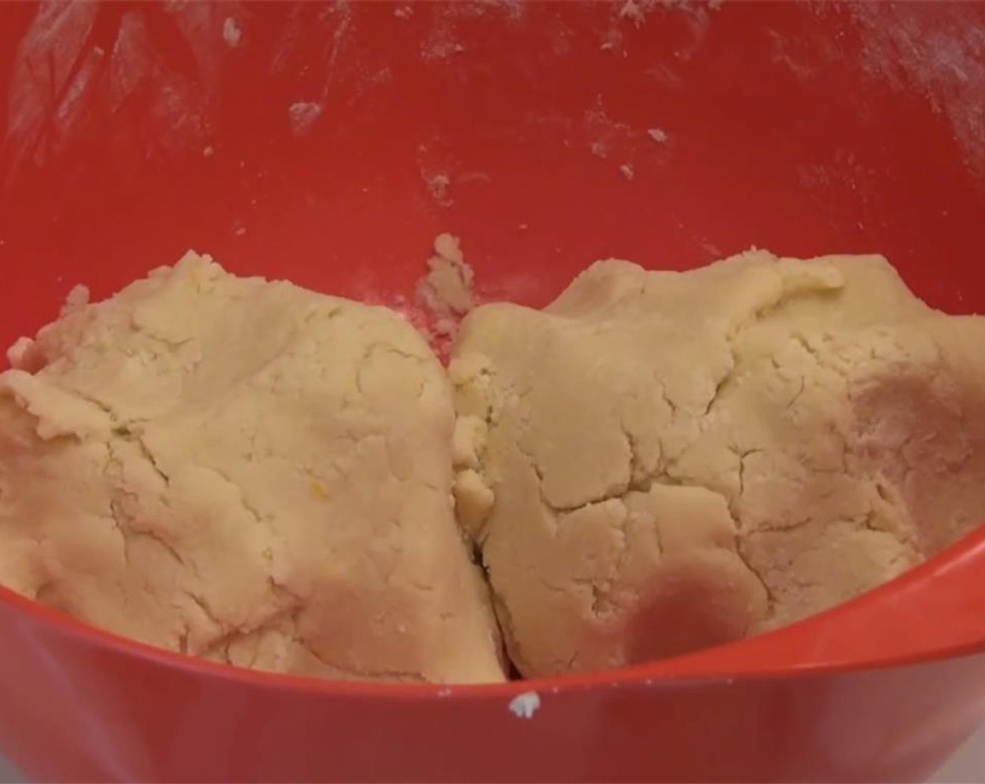 step 6 Use your hands to press the dough together, and form two balls of dough. Sprinkle some flour on a clean counter, and roll out your dough. Cut the dough into your preferred shapes using a cookie cutter. Reuse the scraps as you go.