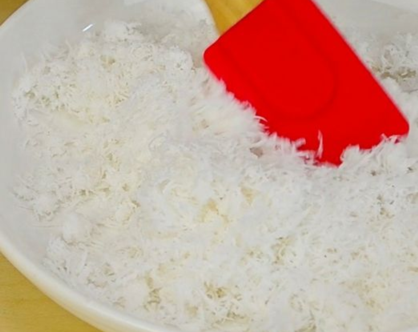 step 1 In a flat bowl, mix Unsweetened Shredded Coconut (1 cup) with Salt (1 tsp). Place the bowl in a skillet with an inch or so of simmering water. Cover, steam for about 5 minutes, then set aside. Next, prepare the filling.