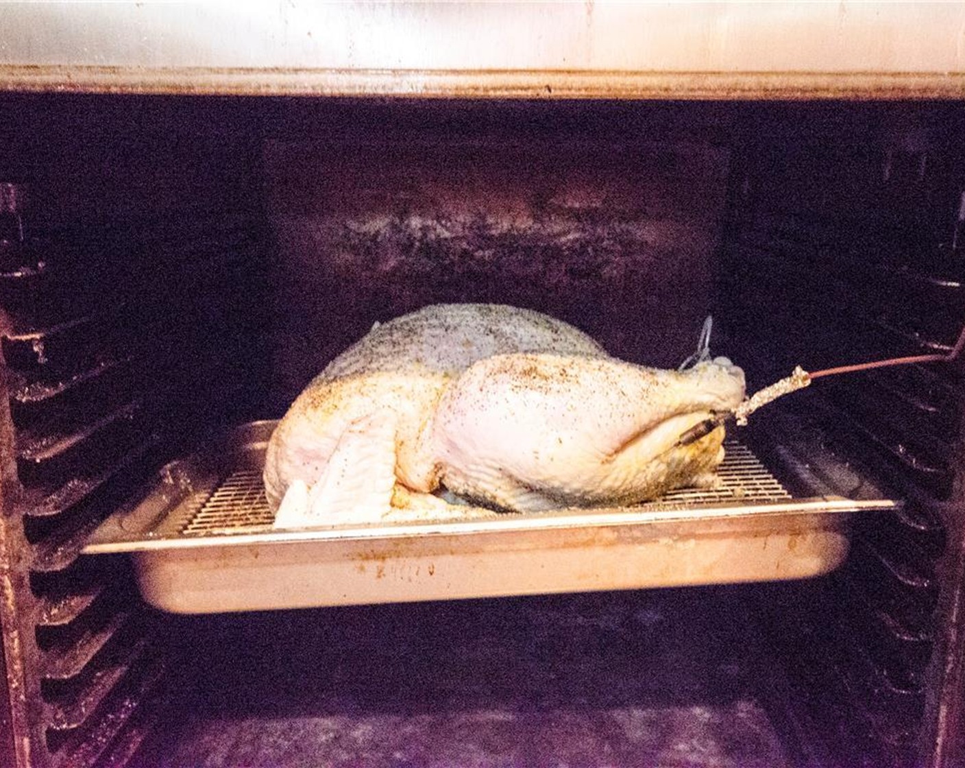 step 7 Place the bag under the grates, but not directly on the fire. Replace the grates. Place the turkey on the grill, breast side up. Close the lid, and smoke for 1 hour. It's important to maintain a temperature of 275-300 degrees F (140-150 degrees C) -don't open the lid.