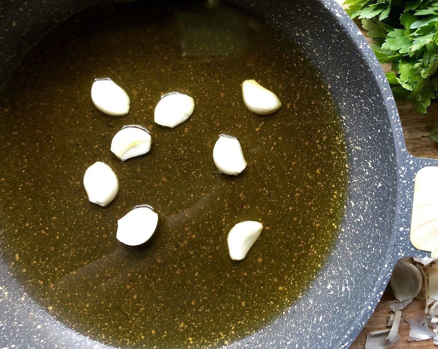 step 1 Heat the Olive Oil (1/2 cup) in a large skillet over medium-low heat. Add Garlic (4 cloves) cloves. Sauté for 5 to 6 minutes until soft and golden. Remove the garlic from the skillet with a slotted spoon. Save for another use.