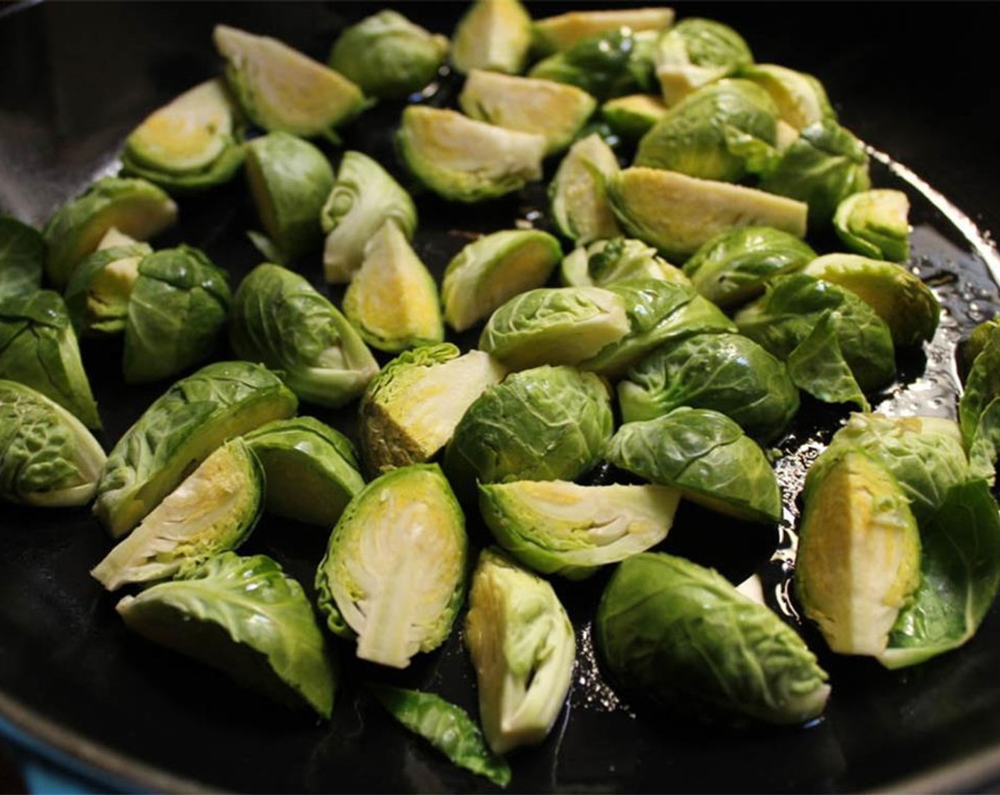 step 1 Heat Extra-Virgin Olive Oil (2 Tbsp) in a large skillet. When hot, add the Brussels Sprouts (12)
