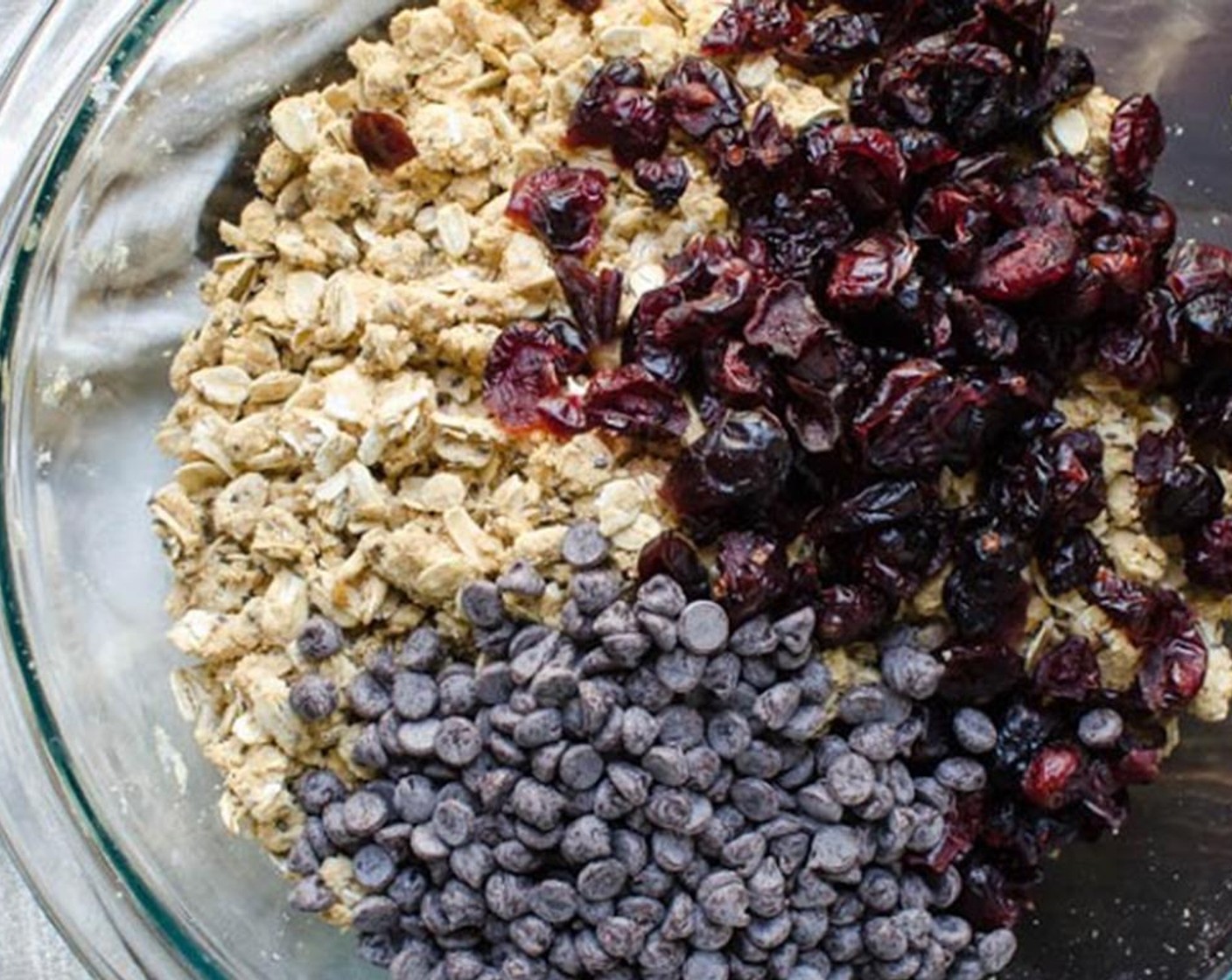 step 4 Add the Dried Cranberries (1/3 cup) and Mini Chocolate Chips (1/3 cup) and stir to combine. Add 2 tablespoons almond milk and mix well with your hands, mixture will be sticky.