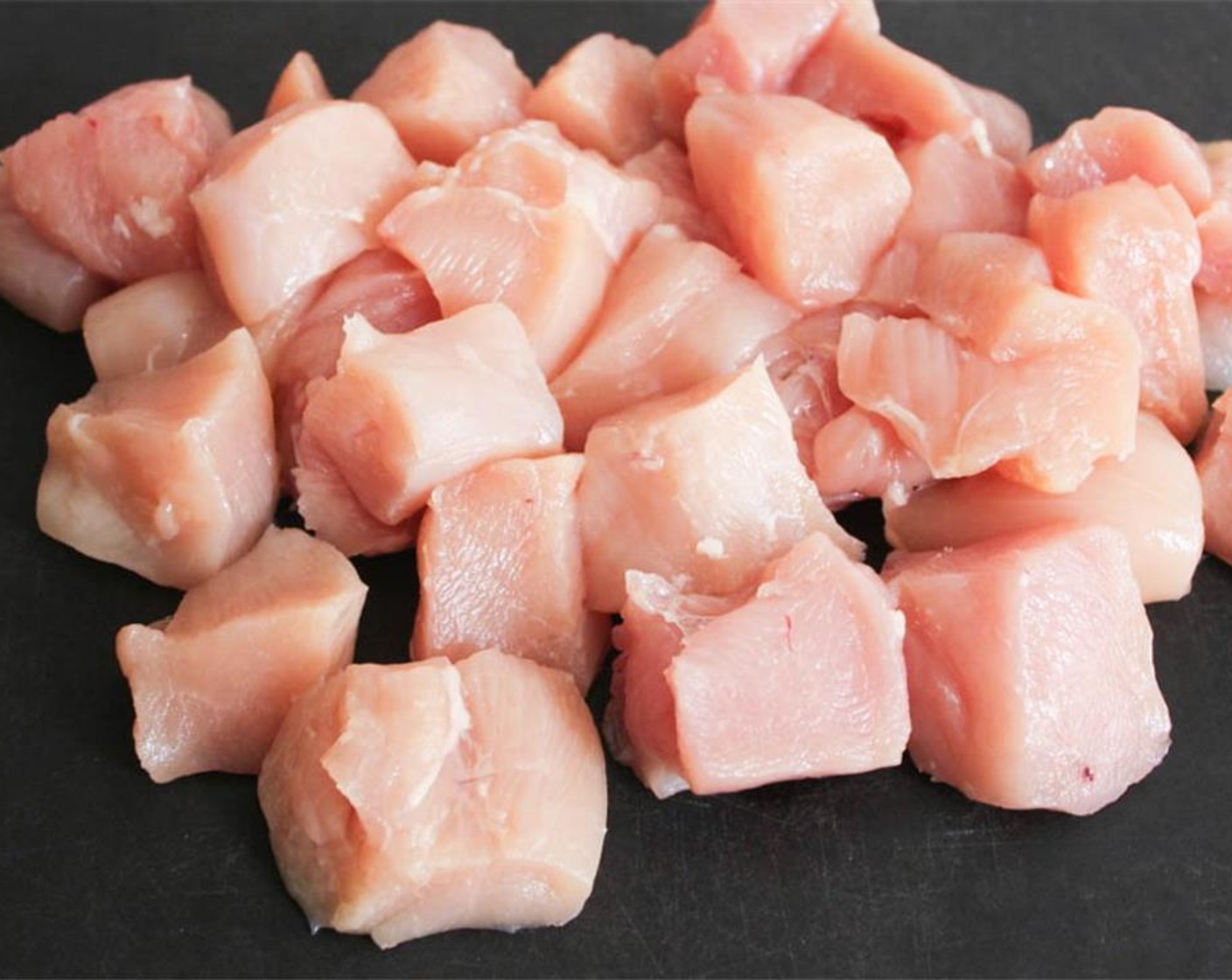 step 2 Dice the Chicken Breasts (4) into 1.5 inch, or 3.5 centimeter cubes.
