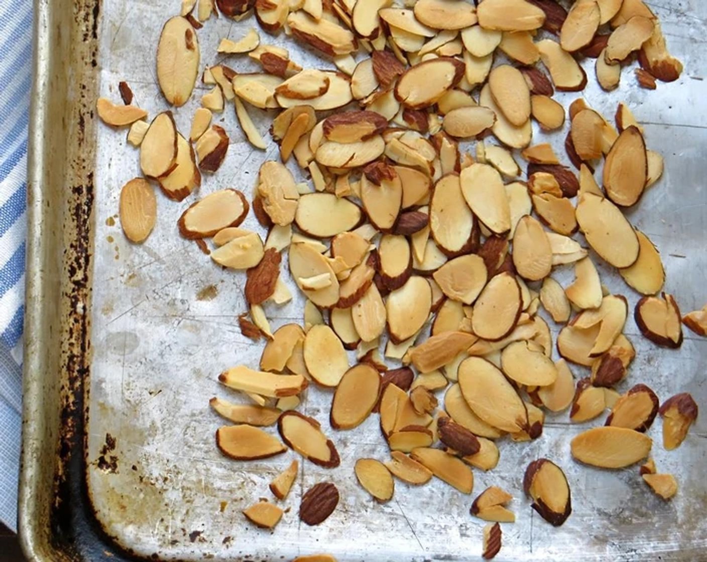 step 2 Lay the Sliced Almonds (1/4 cup) in a single layer on a sheet pan.