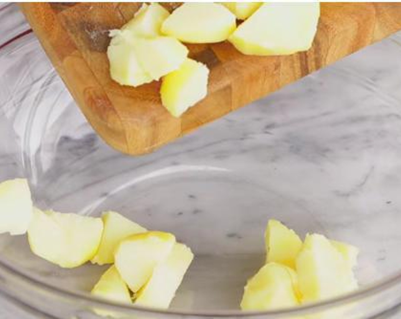 step 1 Cut down the boiled Potatoes (2 lb) into small pieces, and set them aside inside a bowl.