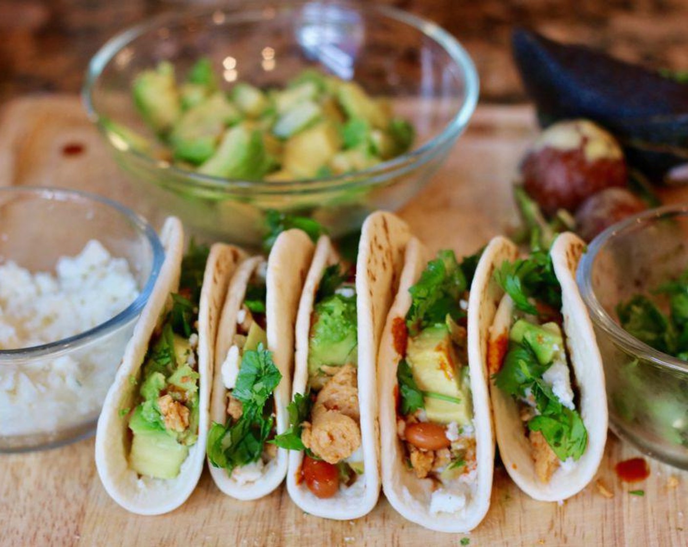 step 4 Garnish with Fresh Cilantro (to taste), Queso Fresco (1/4 cup), Avocado (1), and Hot Sauce (to taste). Fold in half and serve.