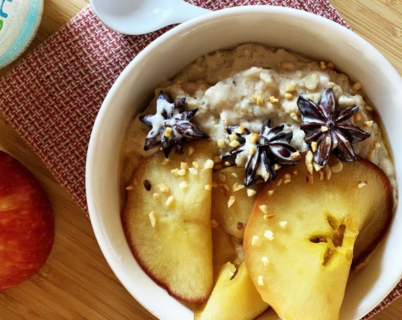 step 6 Pour the oatmeal in 2 serving bowls. Top with the cooked apple and the juice. Serve it right up! (Don't eat the star anise, it's just for flavoring).