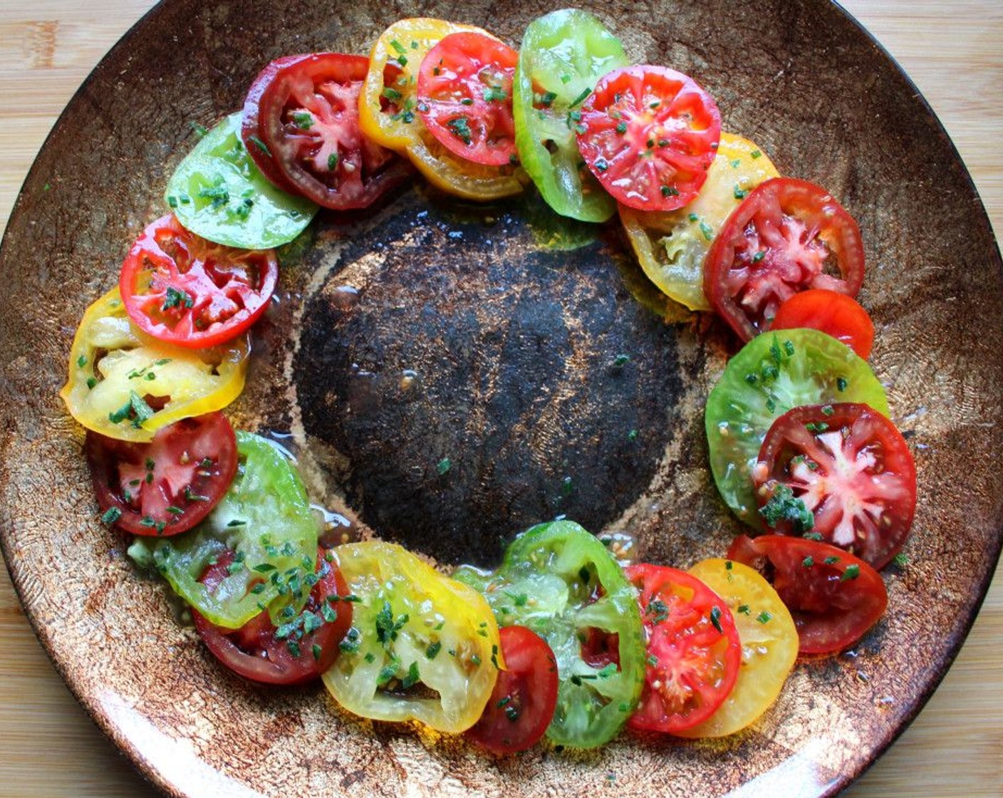 step 2 Drizzle the Heirloom Tomatoes (2 1/2 cups) with more Vinaigrette (to taste).