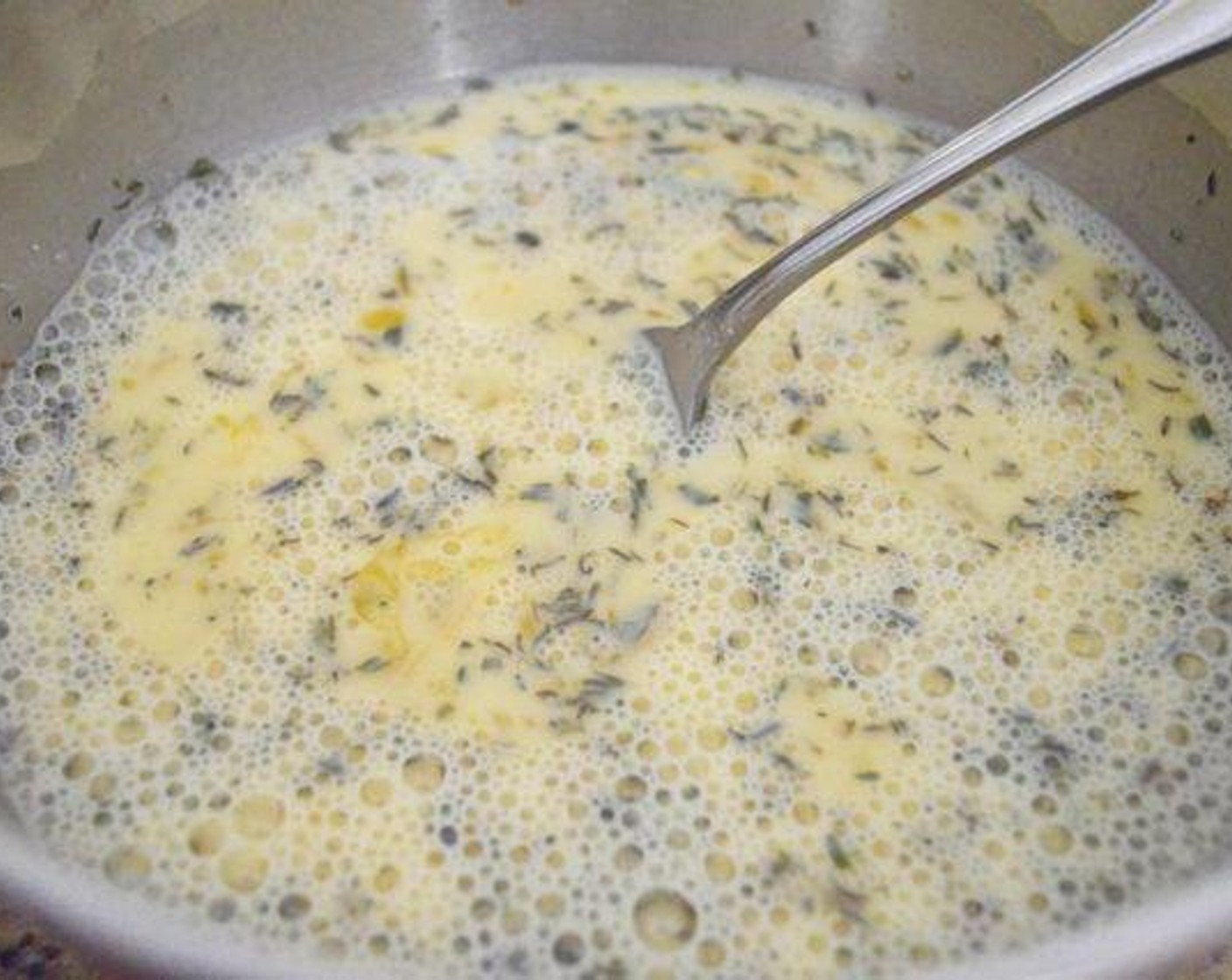 step 4 Whisk the Eggs (5), Milk (3/4 cup), Salt (1 pinch), Ground Black Pepper (1 pinch), Herbes de Provence (1 tsp), and McCormick® Garlic Powder (1/2 tsp) together in a bowl.