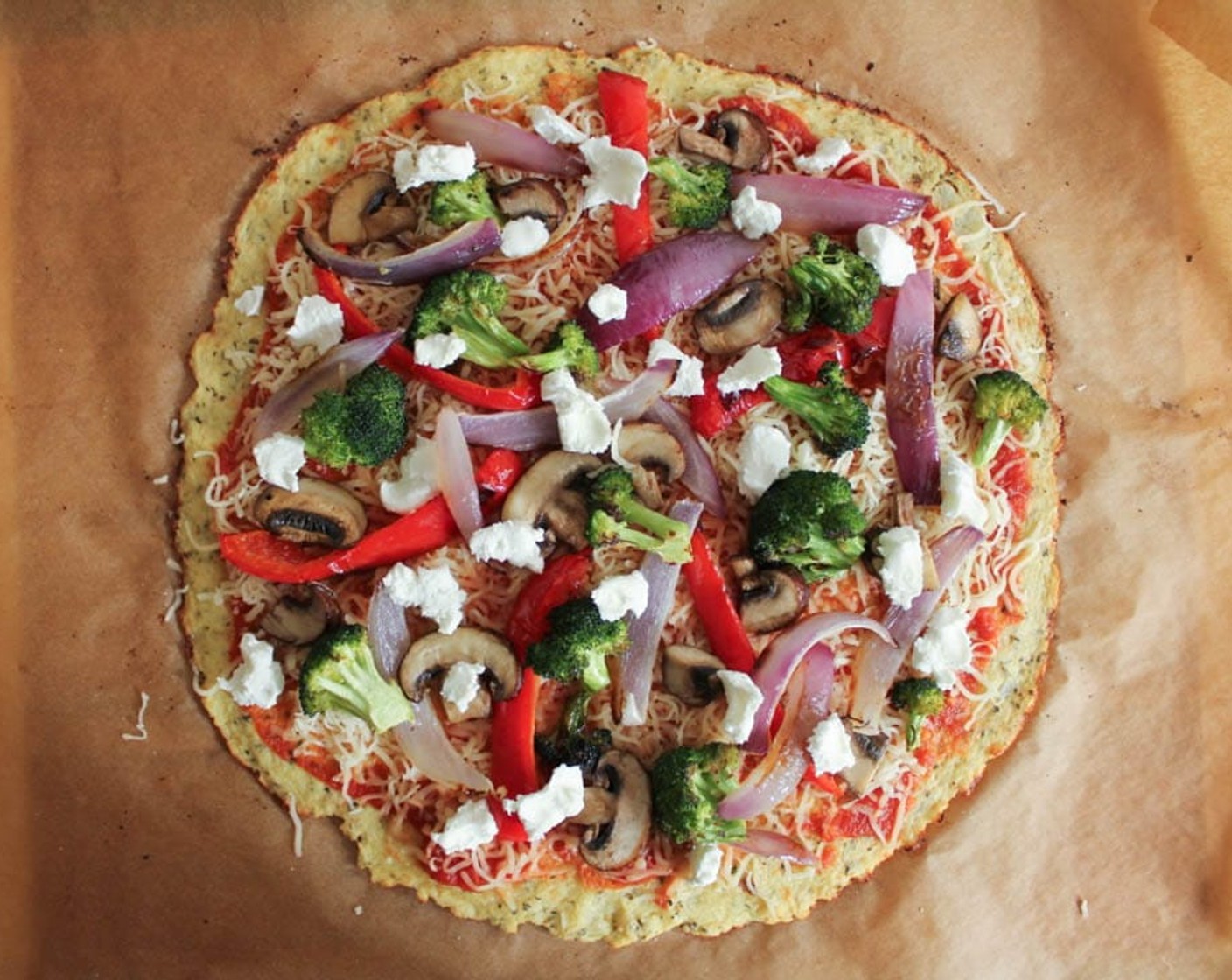 step 15 Spread the Pizza Sauce (1/4 cup) over the pizza dough and sprinkle with an even layer of Shredded Part-Skim Mozzarella Cheese (1/2 cup). Top with the roasted vegetables, sautéed mushrooms, and Goat Cheese (2 Tbsp).