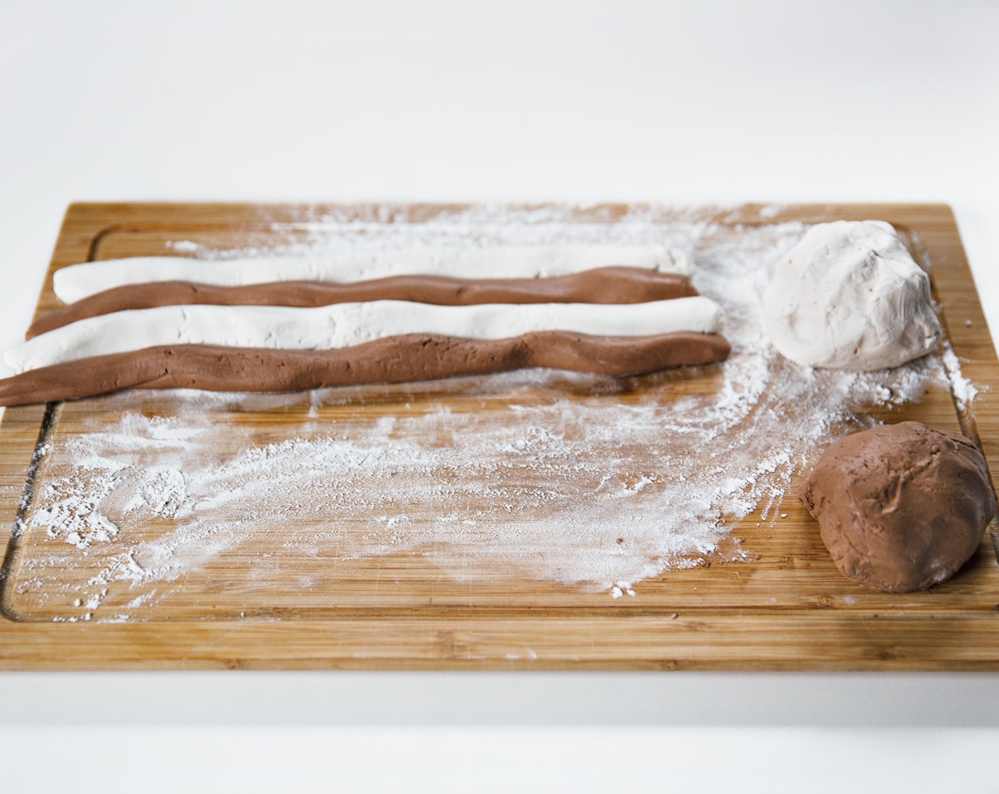 step 10 Roll the dough into long cylinders, with alternating side by side.