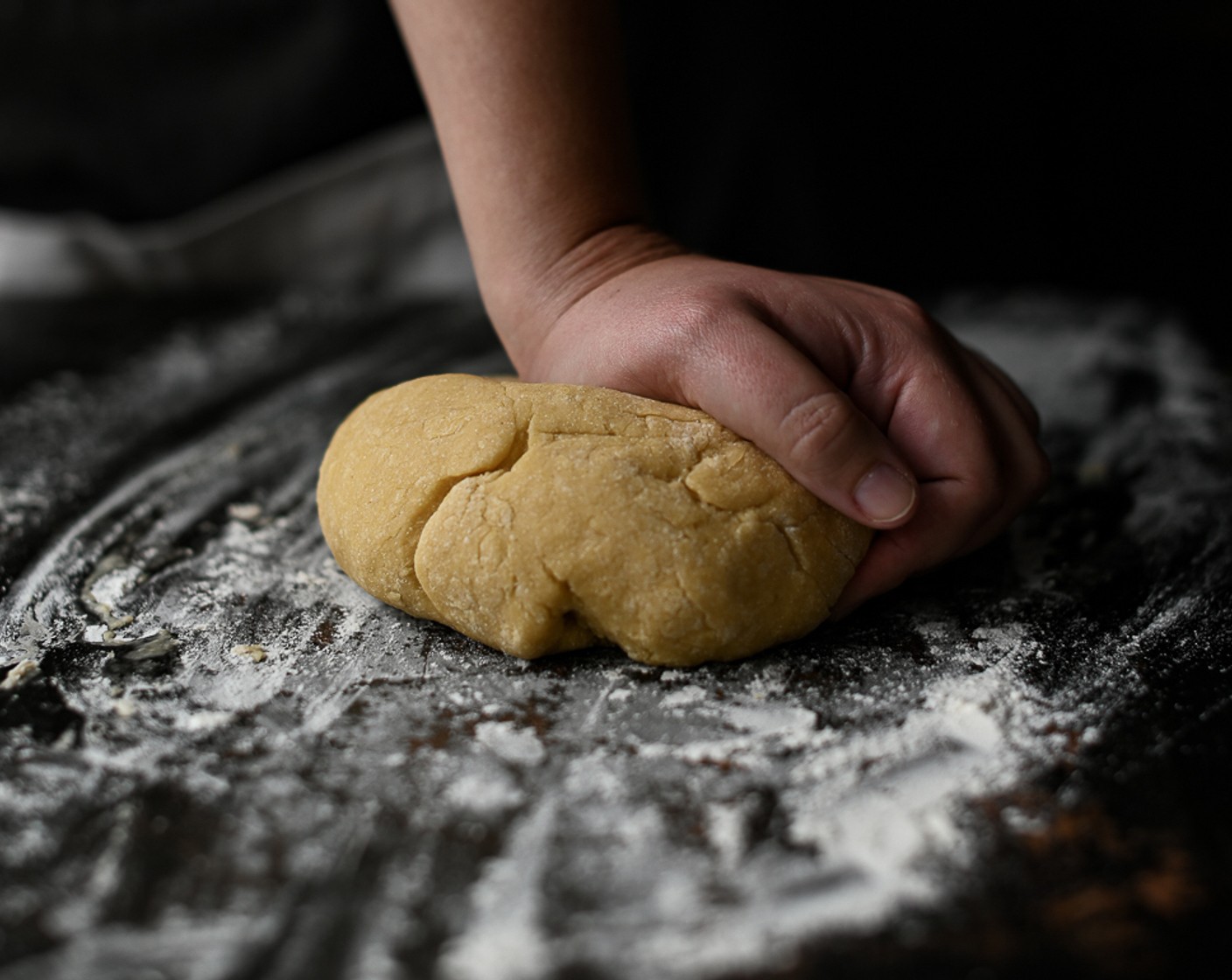 step 7 Dust the work surface with flour and knead the dough until it is smooth and elastic. Wrap the dough in clingfilm and leave to rest for half an hour.