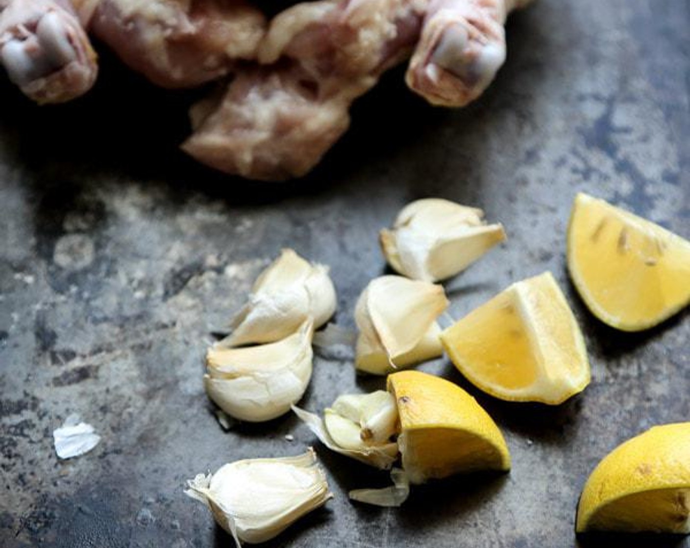 step 2 Remove the giblets from the cavity of your Whole Chickens (3.5 lb), then rinse the chicken thoroughly with water, and dry it well with paper towels. Stuff the cavity with the Garlic (5 cloves) and Lemon (1/2).