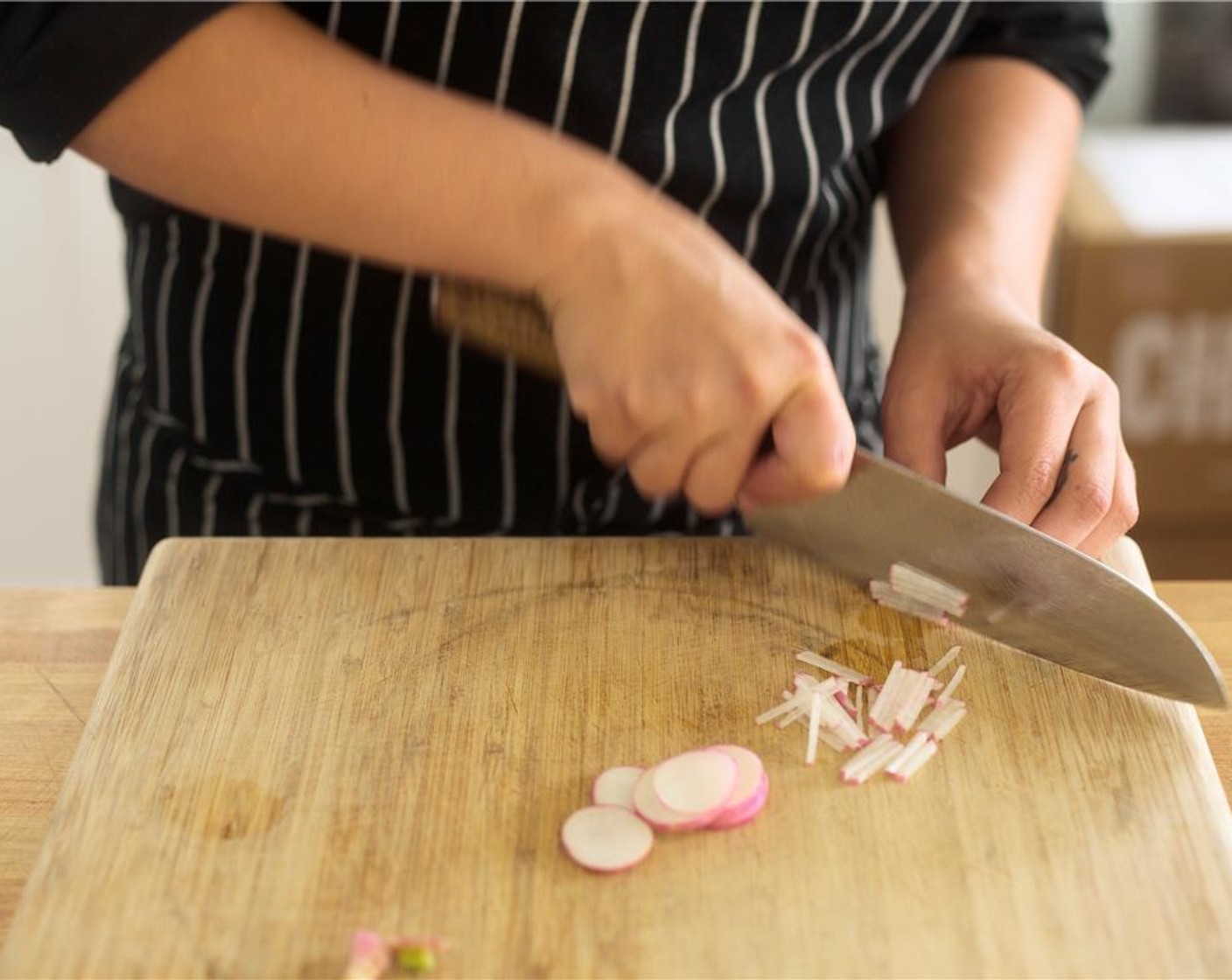 step 6 Cut radishes into thin slices. Stack slices and then slice into thin matchsticks. Hold for garnish with green onions.