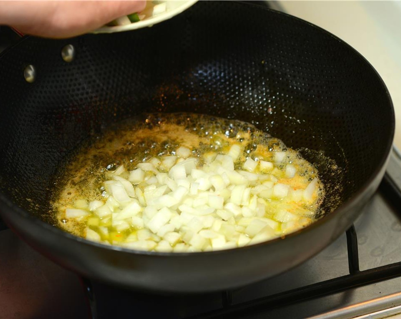 step 2 Add the Butter (to taste) to the reserved bacon fat. Turn the heat to medium. Once butter is melted, add the Yellow Onions (1 1/2 cups) and Creole Seasoning (1 Tbsp). Cook onions until opaque, about 5 minutes.