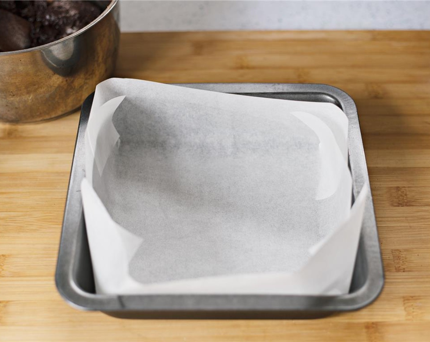 step 7 Prepare a baking tin with parchment paper.