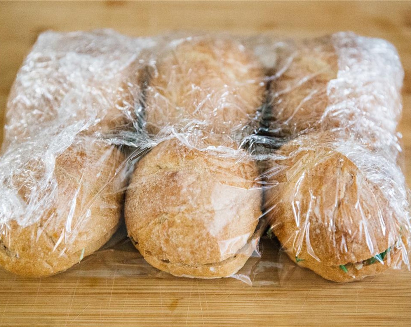 step 14 Wrap boules with cling-wrap, place on a baking tray, place another baking tray on top and weigh down with a few tins. Place in the refrigerator for about 2 hours.